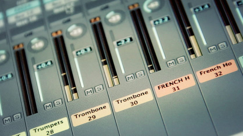 Audio mixing board faders close-up